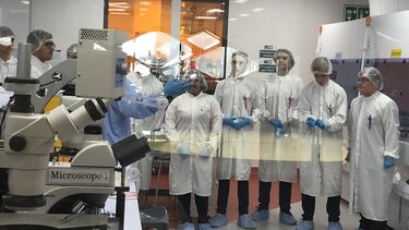 Students in lab coats in the teaching clean room in the Diamond