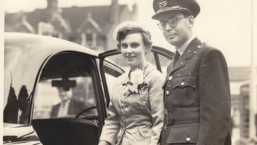 Eric and Winifred Bateson standing by a wedding car