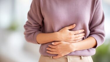 A person holding their stomach.