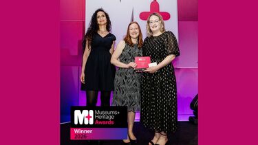 Dr Heather Ellis being presented with the Museum and Heritage award