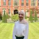 Profile photo of MSc student in front of a red brick building