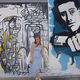 Jess standing in front of graffiti