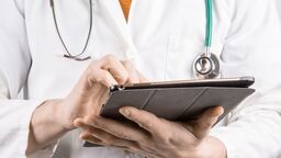 Doctor holding a tablet computer