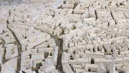 A minuature model of a city with a large number of buildings and roads